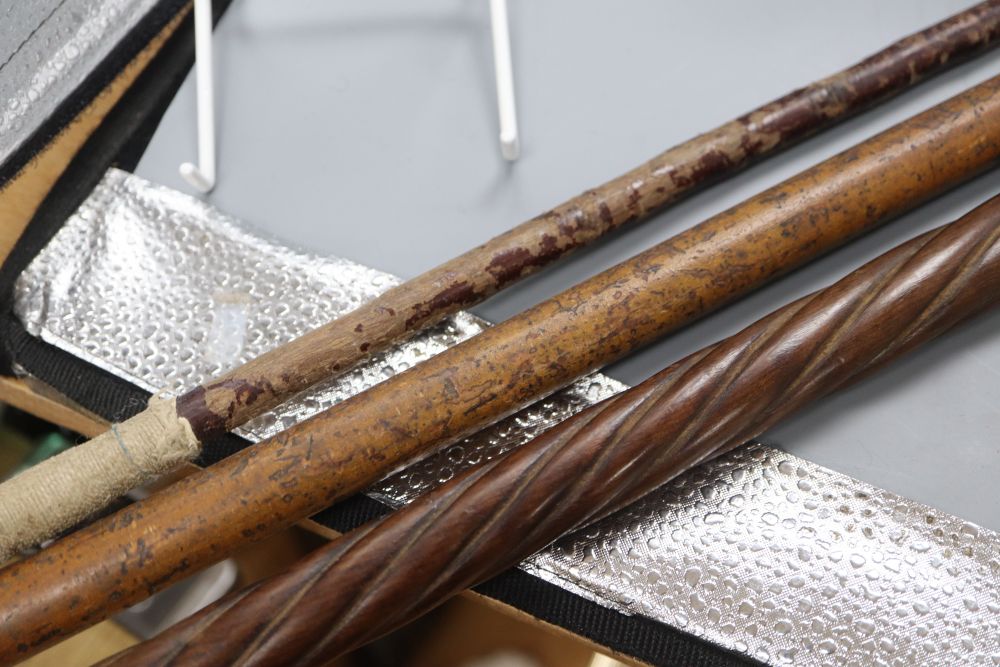 Two walking canes, one with horn handle, the other silver mounted handle, together with a riding crop